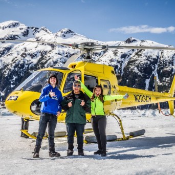 a couple of people that are standing in the snow