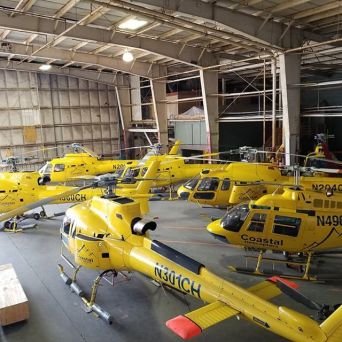 a small airplane is parked on the side of a building