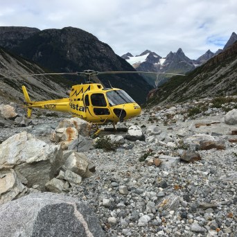 a person sitting on the side of a mountain
