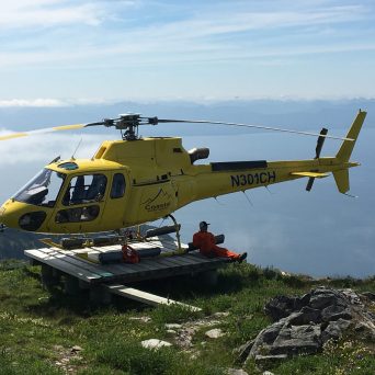 a helicopter parked in a grassy area