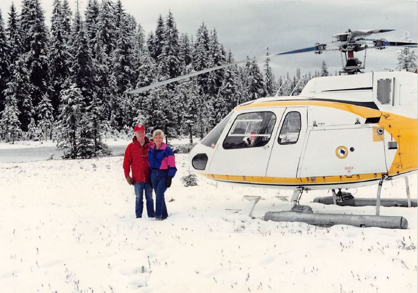 a couple of people that are standing in the snow