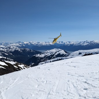 a man riding skis down a snow covered slope