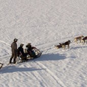 a group of people skiing on the snow